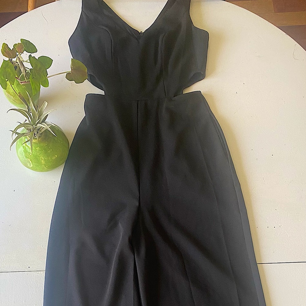 Crystal Sky Black jumpsuit with waist cutout.